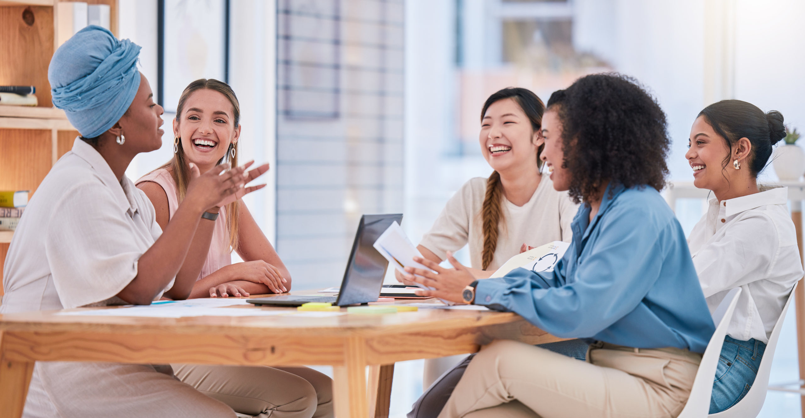 Business team, empowerment and female meeting in casual work environment. Trust, collaboration and diversity in an inclusive company. Coaching, motivation and positive woman working in leadership.